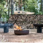 Roasty Boss Pot and firewood for BBQ in yard