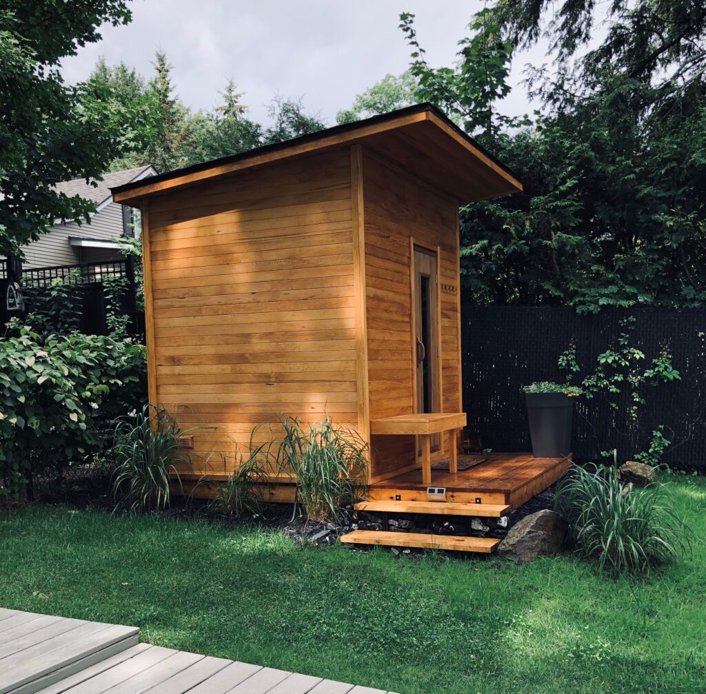 Cedar outdoor sauna on a garden deck